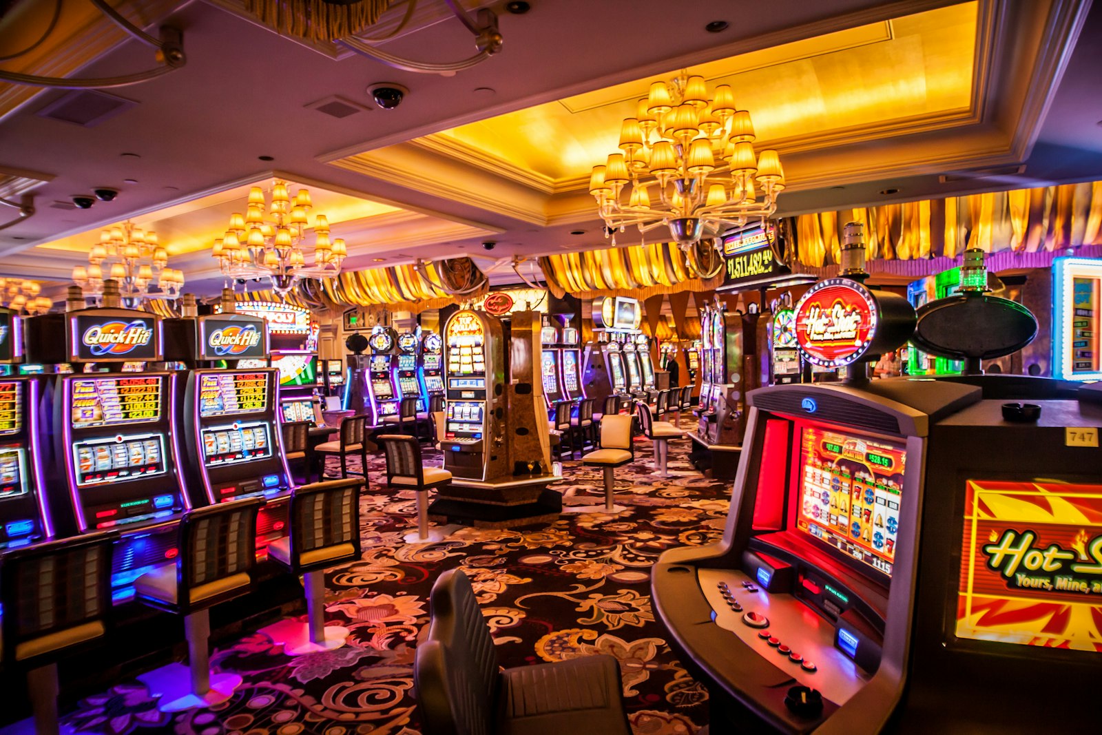 Casino floor lined with jackpot slot machines